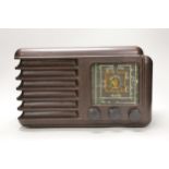 An Art Deco style brown Bakelite Westminster radio, 37cm wide