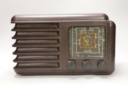 An Art Deco style brown Bakelite Westminster radio, 37cm wide