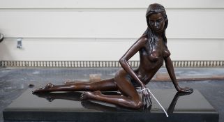 Jonathan Wylder (born 1957). A bronze reclining nude 'Prague', one of edition of eight, 38cm wide,