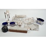 A group of mixed silver ware including a manicure stand, toastrack, purse, two compacts, four