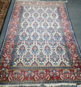 A Kashan ivory ground rug, 200 x 133cm