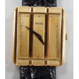 A gentleman's modern 18ct gold Piaget quartz dress wrist watch, with 'blind' rectangular dial, on