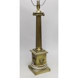 A large brass desk lamp in the form of a tapering column, on plinth base, 56cm to top of column