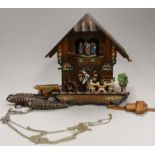 A Schneider German carved wood cuckoo clock