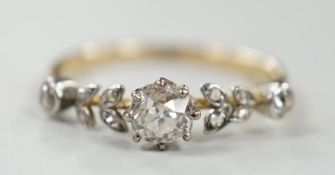 An 18ct and diamond cluster set half hoop ring, of foliate design, size N, gross weight 2.3 grams.