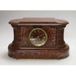 A French rouge marble eight day mantel clock, 38cm wide