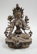 A Himalayan bronze seated figure of Green Tara, 29cm tall