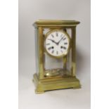 An early 20th century brass four glass mantel clock, 27cm