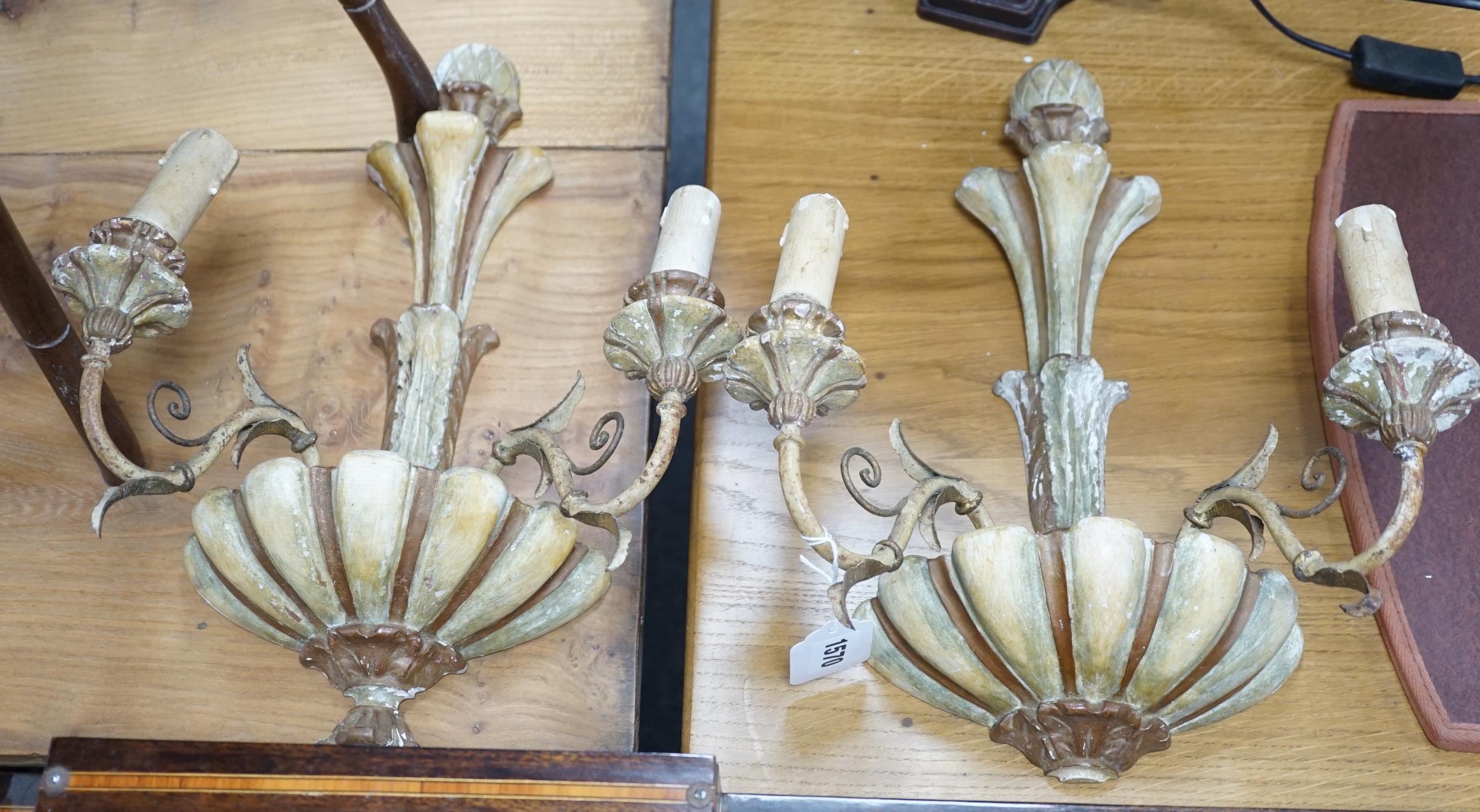 A pair of French painted and wrought iron two branch wall lights, 39cm high