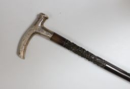 A Chinese silver mounted carved hongmu walking stick, 92cm