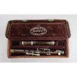 A late Victorian rosewood flute, by Hawkes & Son, leather case