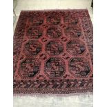 A Bokhara red ground rug, 180 x 156cm