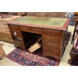 An early 20th century oak kneehole desk, length 141cm, depth 72cm, height 76cm