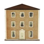 A furnished English dolls’ house, circa 1810-20, with three rooms on three floors surmounted by a