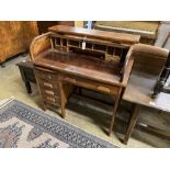 An early 20th century mahogany tambour kneehole writing desk, width 102cm, depth 62cm, height 103cm