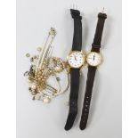 A lady's steel and gold plated Longines quartz wrist watch, one other watch, a 9ct and gem set bar