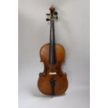 A Vuillaume violin with a bow, in case, back measures 36cm excl button