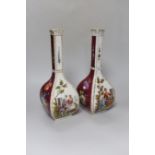 A pair of early 20th century Dresden square bottle vases, 31cm