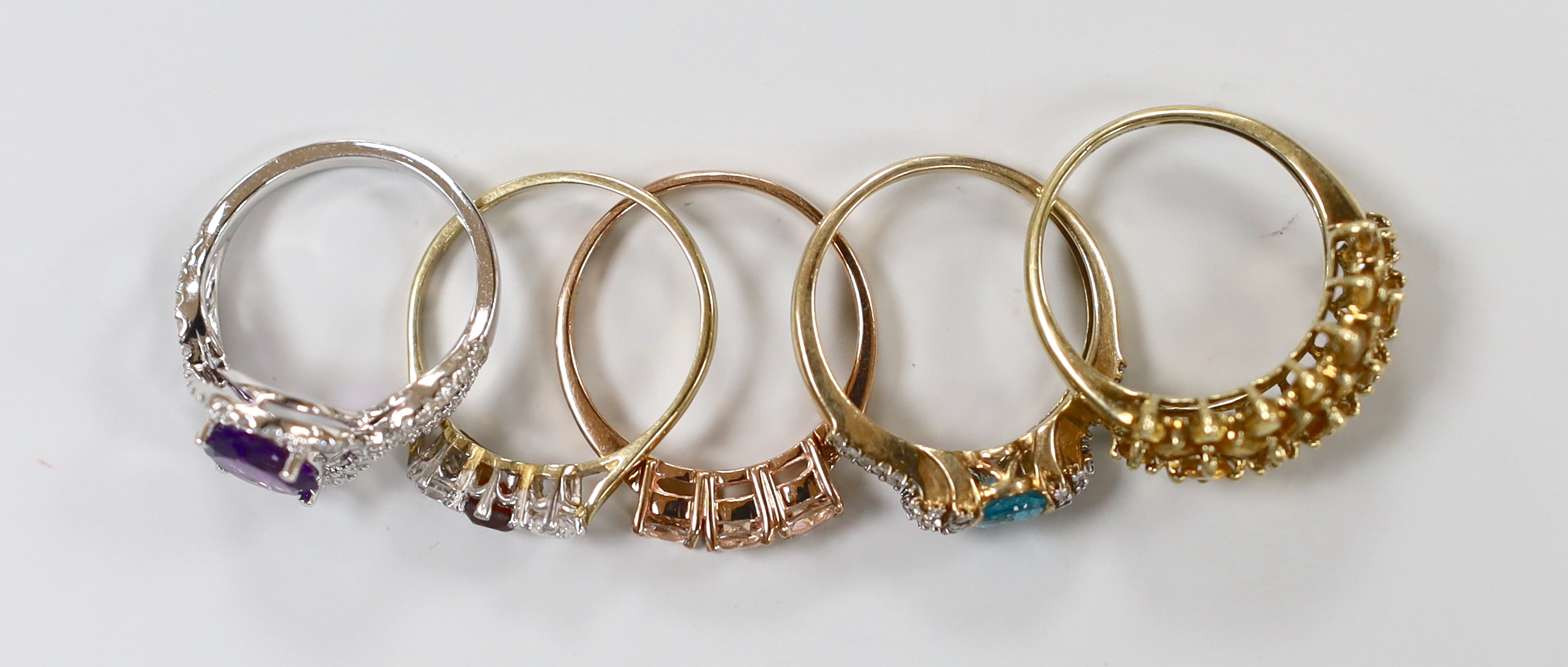 Five assorted modern 9ct gold and gem set rings including a white gold, amethyst and diamond ring, - Image 2 of 2