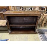 A late Victorian carved oak open bookcase, width 137cm, depth 37cm, height 108cm