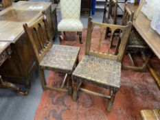 A set of four spindle back dining chairs with leather strapwork seats