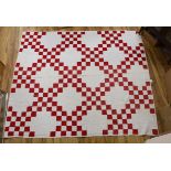An American quilt Texas Star pattern, red on white backing