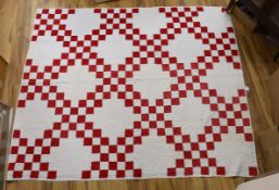 An American quilt Texas Star pattern, red on white backing