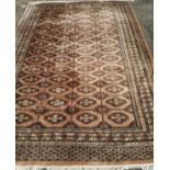 A Bokhara peach ground carpet, 280 x 186cm