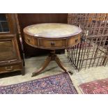 A reproduction mahogany small drum table with tooled green leather top, diameter 76cm, height 71cm