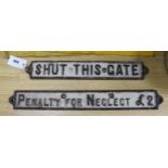 Two cast iron signs 'shut this gate' and 'penalty for neglect £2'