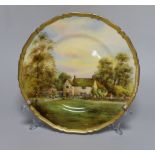 A Royal Worcester plate, painted with Lugrave Manor by E. Barker, signed, date mark for 1929