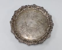 A late George II silver waiter, with engraved crest and later chased decoration, Ebenezer Coker,