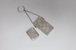 A late Victorian chased silver card case, S. Blanckensee & Son Ltd, Birmingham, 1886, 76mm and a