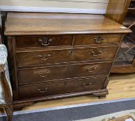 A George III mahogany and crossbanded chest, c.1760, the two short and three long drawers flanked by