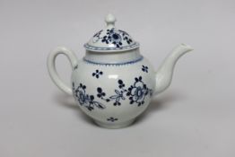 A Liverpool teapot and cover painted with flowers in underglaze blue, c.1775, 15cm tall