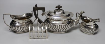 A late Victorian demi-fluted silver three piece tea set, Birmingham, 1899/1900 and a later small