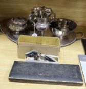 A plated tray, mixed silver and other squat candlesticks, photo frames etc