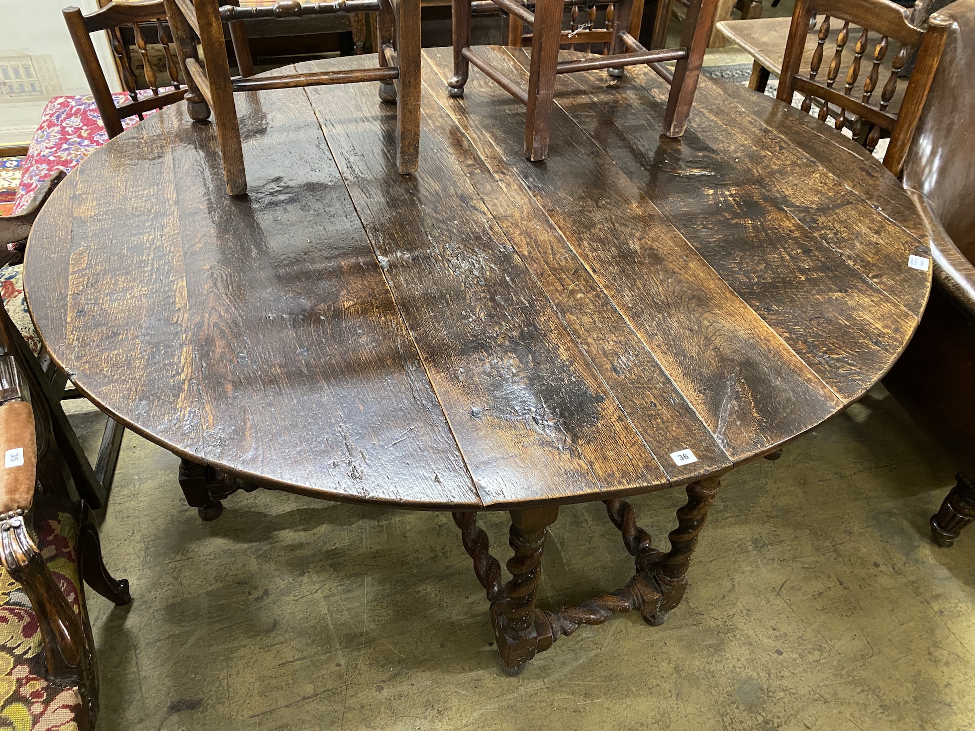 An 18th century oak gateleg dining table, length 172cm, extended, width 152cm, height 73cm - Image 2 of 2