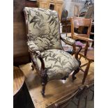 A Victorian rosewood upholstered open armchair, width 65cm, depth 72cm, height 95cm