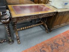 A Victorian leather topped carved oak writing table, width 105cm, depth 60cm, height 74cm