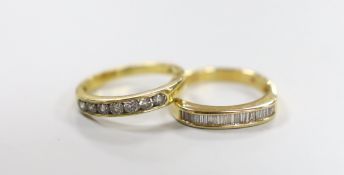 Two modern 18ct gold and channel set diamond half eternity rings, sizes P, gross weight 7.2 grams.