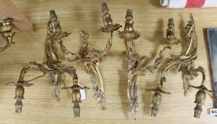 A set of four two branch gilt sconces, 36cm tall