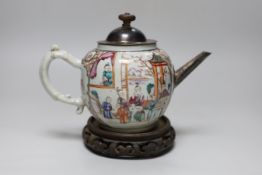 An 18th century Chinese export famille rose teapot with later silver spout and cover, on hardwood