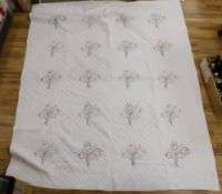 A 1920's American friendship dowry quilt embroidered with flowers, initialled