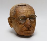 A carved coconut head of a gentleman, 22cm tall