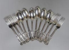 A set of six Victorian silver fancy pattern table spoons and four table forks by John Samuel Hunt,