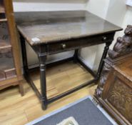 A Charles II oak side table, c.1680, with a drawer, the square and turned legs joined by stretchers,