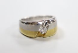 A modern two tone yellow and white metal solitaire diamond set ring, size S, gross weight 12.5