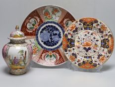 A Dresden pink ground jar and cover with gilt and floral decoration, 23cm tall, an Imari charger and