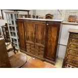 An early Victorian mahogany breakfront compactum wardrobe, width 220cm, depth 58cm, height 199cm